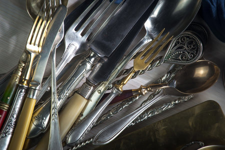 Vintage silverware on a wooden table. Selective focus.の写真素材