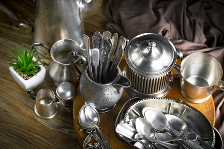 Vintage silverware on a wooden table. Selective focus.の写真素材