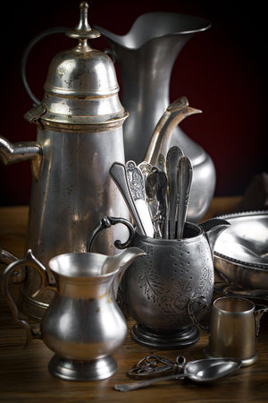 Antique silverware on a wooden table. Selective focus.の写真素材