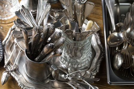 Vintage silverware and cutlery on rustic wooden backgroundの写真素材