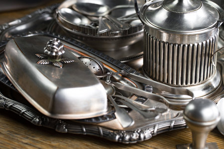 Vintage silverware on a wooden table. Selective focus.の写真素材
