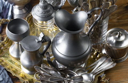 Vintage silverware and utensils on a wooden background.の写真素材