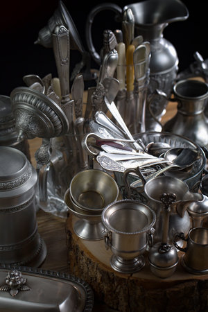 Antique silverware on a wooden table. Selective focus.の写真素材