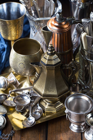Antique silverware on a wooden table. Selective focus.の写真素材