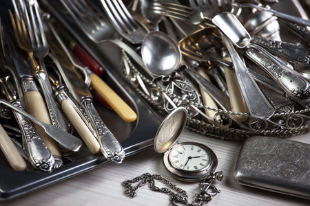 Vintage silverware on a wooden table. Selective focus.の写真素材