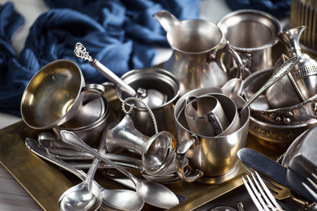 Vintage silverware and utensils on the table in the kitchenの写真素材