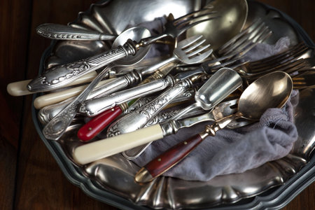 Vintage silverware and cutlery on a rustic backgroundの写真素材