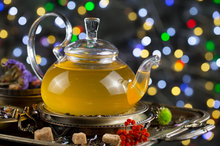 Tea in a glass cup on an old background in composition on the tableの写真素材