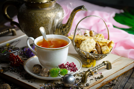 Tea hot drink on old background in composition with accessories on the tableの写真素材