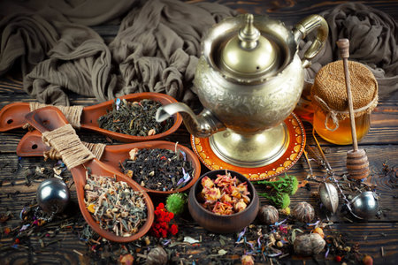 Tea hot drink on old background in composition with accessories on the tableの写真素材