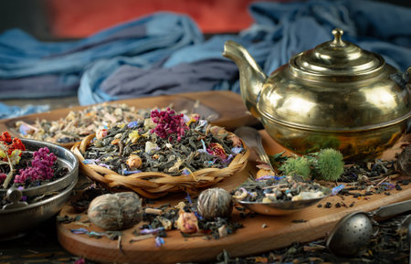 Dry herbal tea in a bowl on an old wooden table.の写真素材