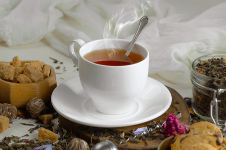 Tea hot drink on an old background in a composition on the tableの写真素材