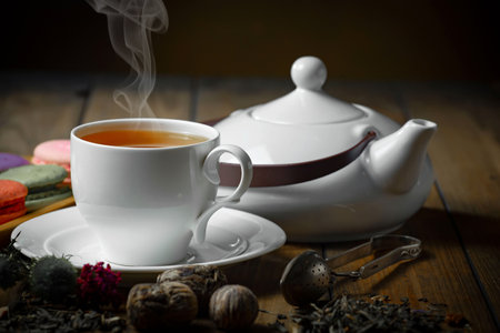Tea hot drink on old background in composition on the table with accessoriesの写真素材