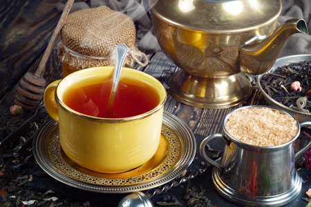 Tea hot drink on old background in composition on the table with accessoriesの写真素材