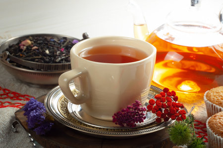 Tea hot drink on old background in composition with accessories on the tableの写真素材