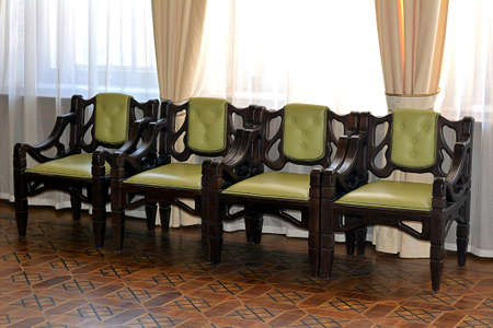 Lonely chairs in an isolated room, acts as background and backdropの写真素材