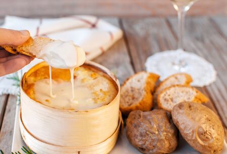Mont d'or cheese. Traditional french  recipe - La boÃ®te chaude. Delicious French Cheese. Mont-d'Or chaud. の写真素材