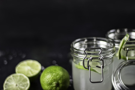 lime juice in glasses on dark stone