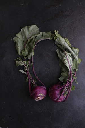 Bunch of whole beetroots farm fresh on dark backgroundの写真素材