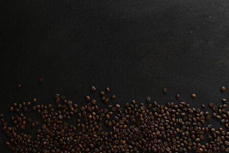 coffee beans on rustic slate background conzept