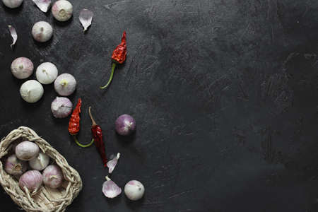 dried chili peppers and garlic on dark backgroundの写真素材