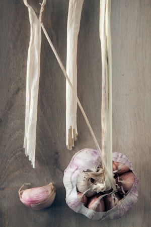Still life with garlic on a chopping board の写真素材
