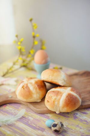 British Easter breakfast table with fresh hot-cross bunsの写真素材