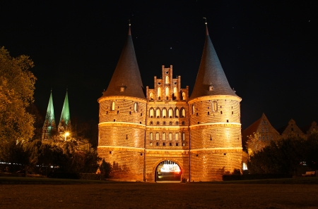 Holsten Gate at night, Lubeck old town, Schleswig-Holstein, Germanyの写真素材