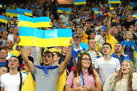 LVIV, UKRAINE - OCTOBER 12, 2014: Ukrainian fans support their team during the UEFA EURO 2016 Qualifying game between Ukraine and Macedonia on Lviv Arenaのeditorial素材