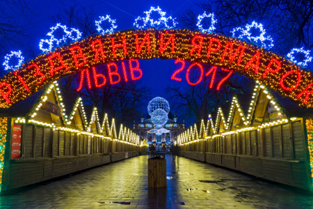 LVIV, UKRAINE - DECEMBER 11, 2016: Christmas holiday market in the center of Lviv on Liberty avenue near Opera Theaterのeditorial素材