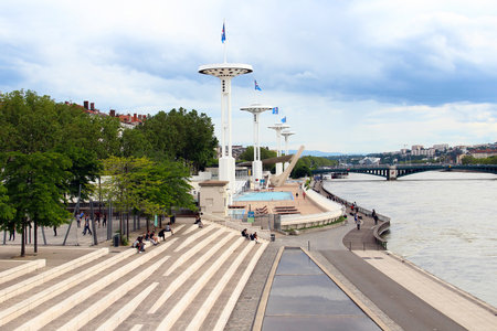 LYON, FRANCE - JUNE 16, 2016: Embankment of Rhone river and open-air swimming pool in downtown Lyon