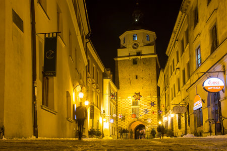 LUBLIN, POLAND - JANUARY 17, 2018: Bramowa street and Brama Krakowska (Krakow Gate) in Lublin old town at nightのeditorial素材