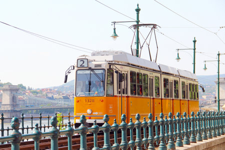 BUDAPEST, HUNGARY - MAY 5, 2018: Old orange tram on the bank of Danube riverのeditorial素材