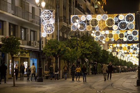 SEVILLE, SPAIN - DECEMBER 15, 2017: Illuminated holiday decorations on Constitution avenue in the center of Sevilleのeditorial素材