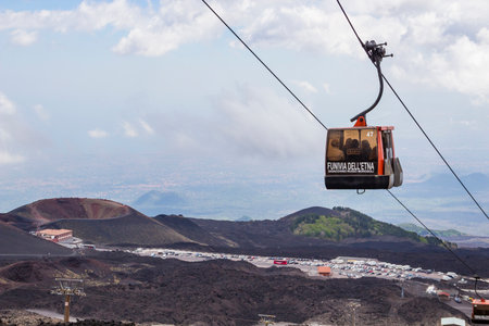 SICILY, ITALY - MAY 7, 2018: Silvestri craters and cable car to Etna volcano from Rifugio Sapienzaのeditorial素材