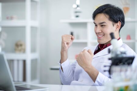 Asian male doctors are happy and smiling when their work is successful.