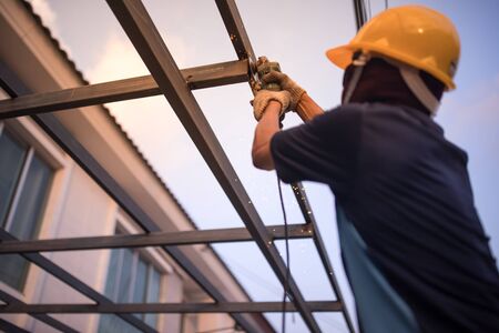 Construction workers constructing house roof structures. Concept House construction work and house construction workers.の写真素材