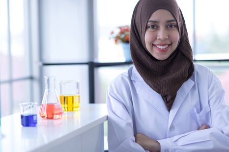 Close Up portrait of muslim female doctor, smiling confident  and looking at cameraの写真素材