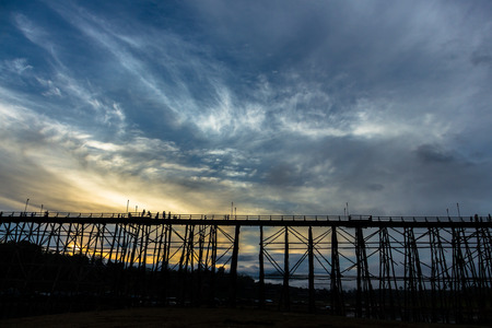 Black silhouette of the wooden bridge in Kanjanaburi province, Thailandの写真素材