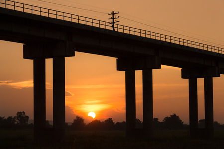 A traing bridge at  Pa Sak Jolasid Dam, Thailand in sunset timeの写真素材