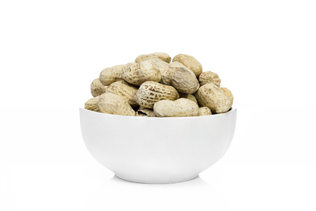 Many Peanuts or groundnut drying in a white bowl