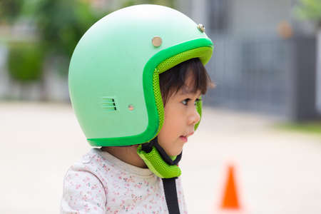 Little girl  workout at home. Cute kid has exercises in living room at home, Distant training with...