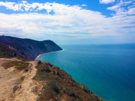 sea rocky coast on a sunny summer dayの写真素材