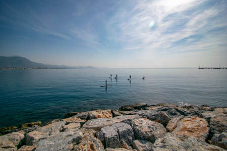 surfers sail on boards on the seaの写真素材