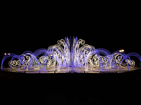 night fountain of light in winter before new yearの写真素材
