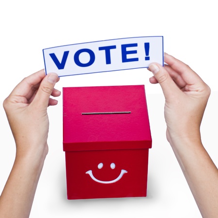 Hands with a voting card 