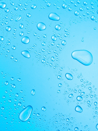 light blue background of beautiful water drops の写真素材