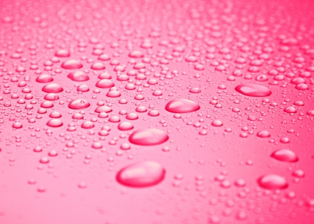 red background of beautiful water drops の写真素材