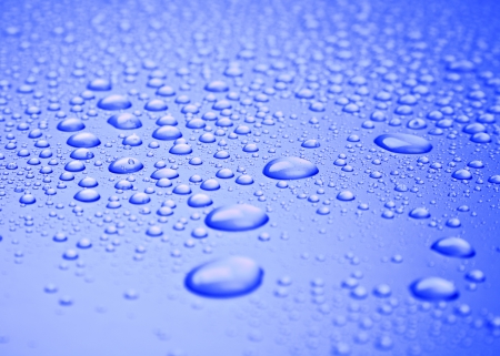 blue background of beautiful water drops の写真素材