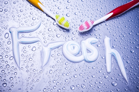 Oral hygiene with sign made of toothpaste and toothbrushの写真素材
